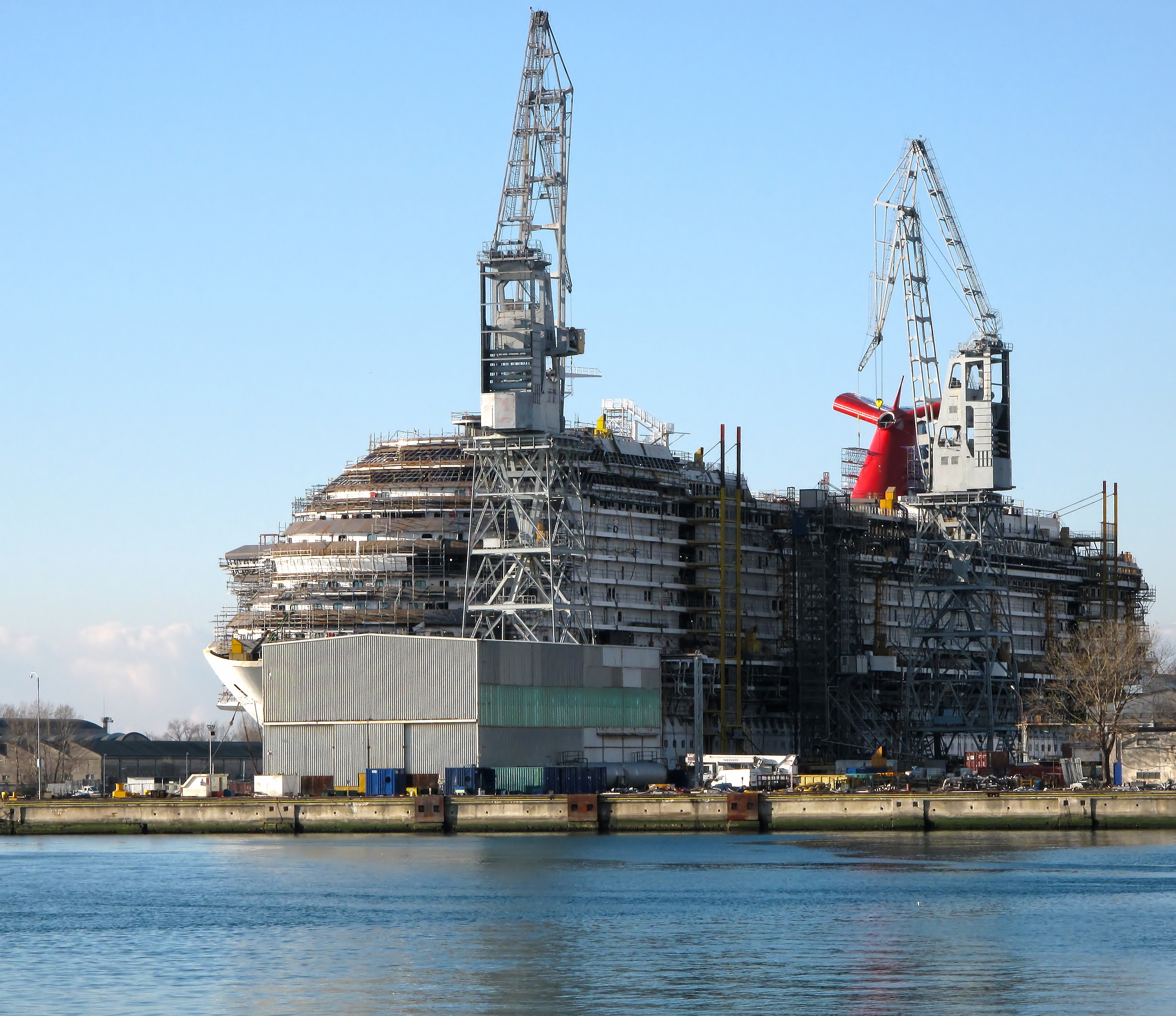 A cruise ship in a shipyard.
