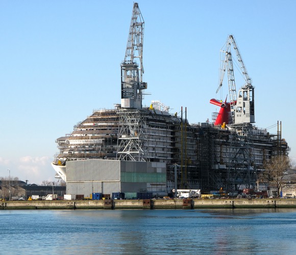 A cruise ship in a shipyard.