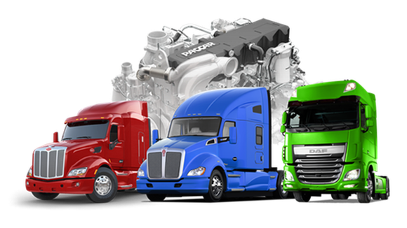 Three trucks in red, blue, and green, next to PACCAR engine.