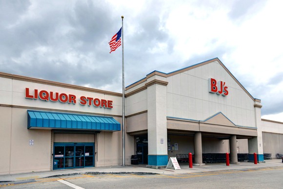 A BJ's Wholesale location with a liquor store next door.