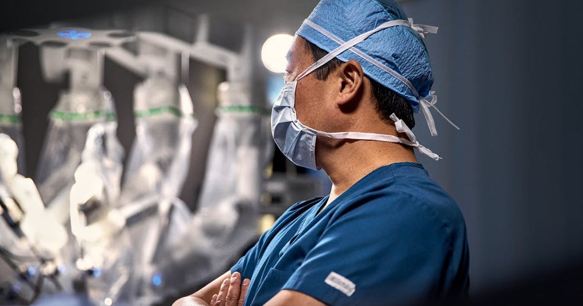 A doctor in a hospital room.