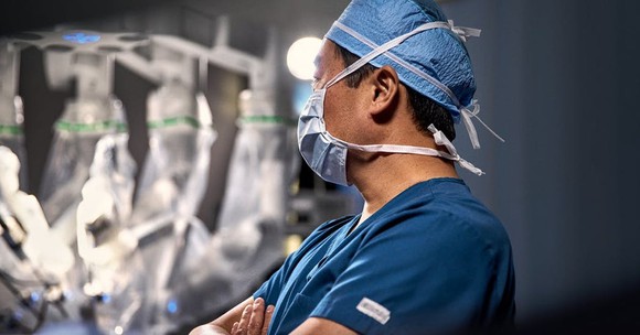 A doctor in a hospital room.