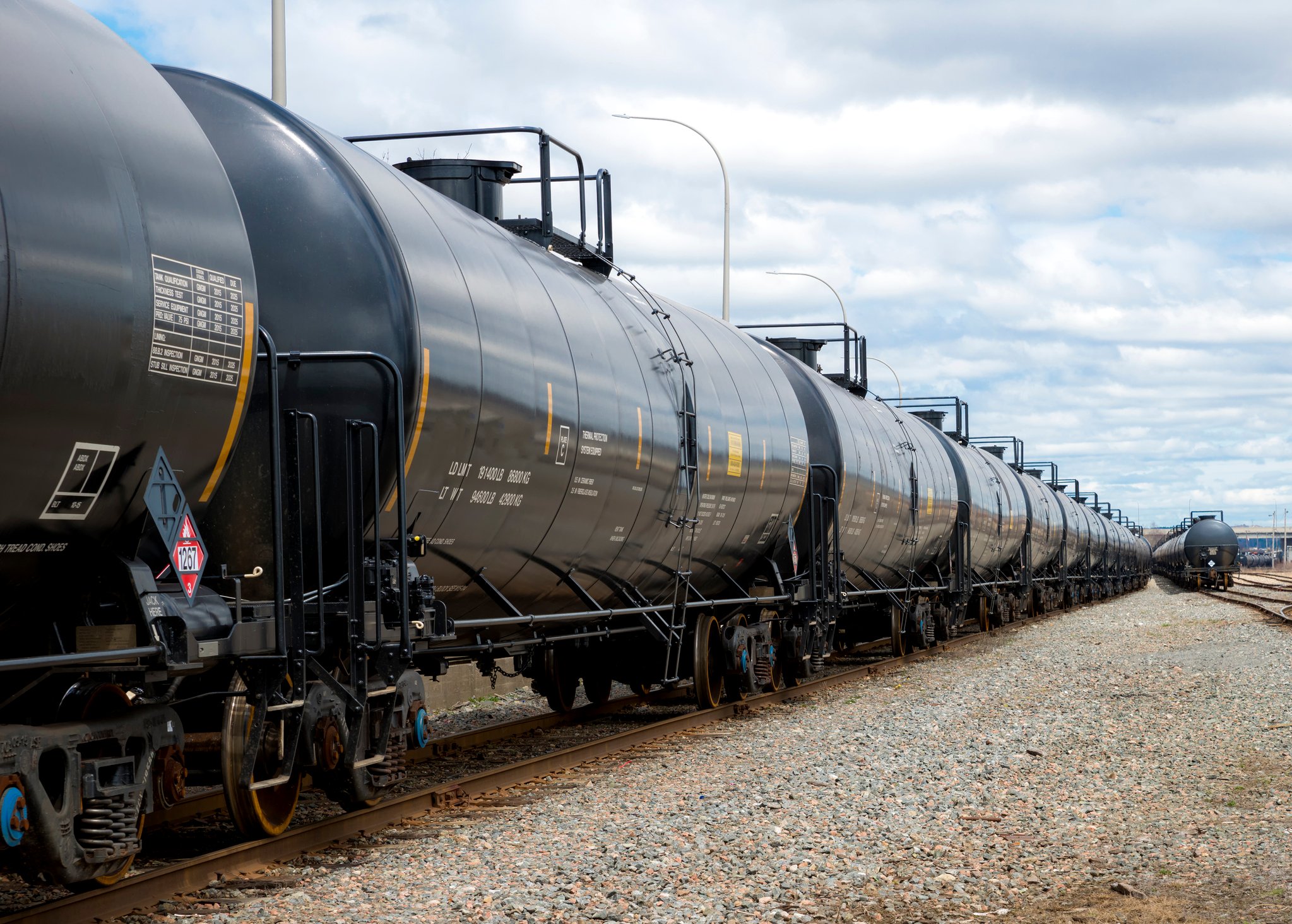 Tanker cars lined up on a rail line