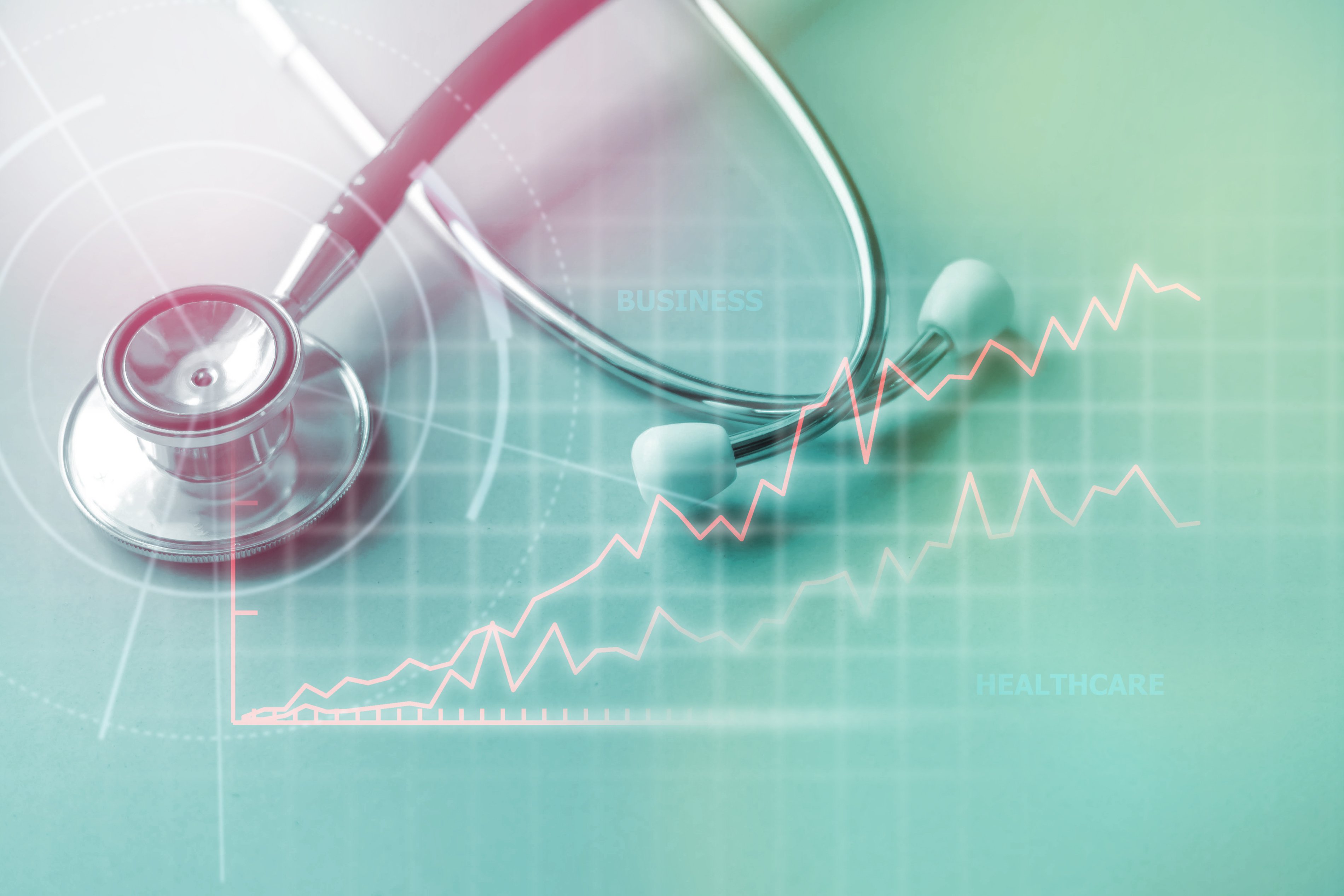 Stethoscope superimposed against a  stock chart.