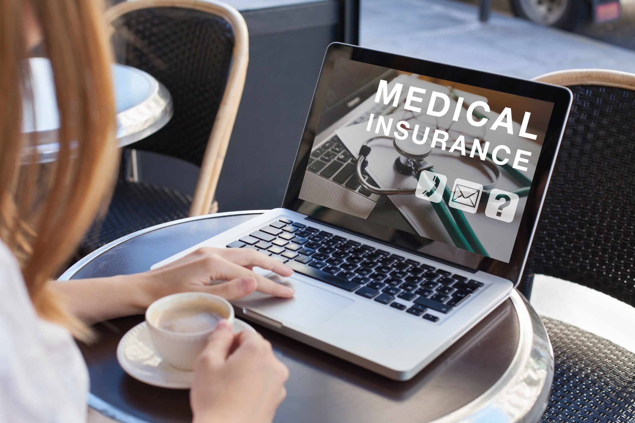Woman with laptop showing medical insurance