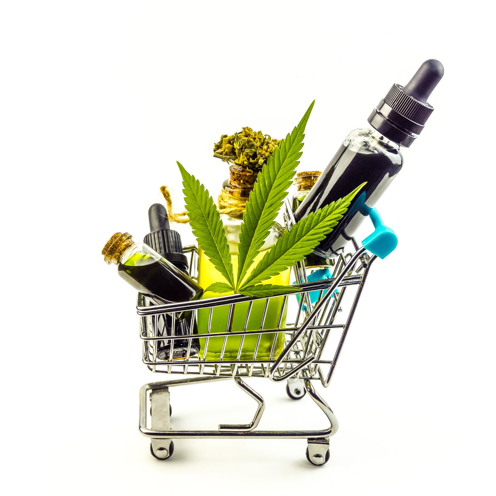 Cannabis products, CBD oil and flower bud in a shopping cart.