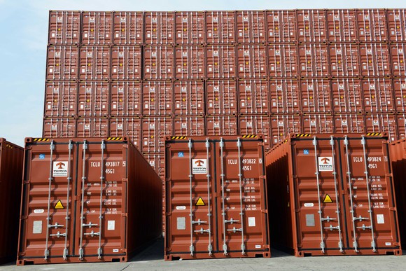 Triton containers stacked at a port.