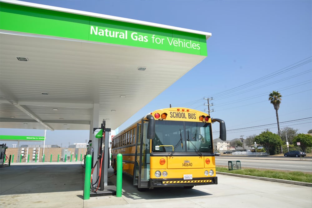 school bus filling up at a natural gas fueling station