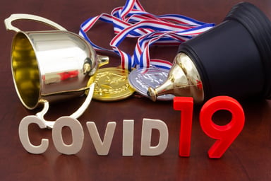 COVID-19 with trophy, gold and silver medals