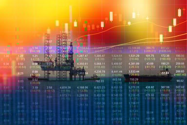 Stock market chart with oil rig in the background