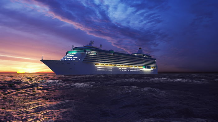 A cruise ship sailing at sunset.