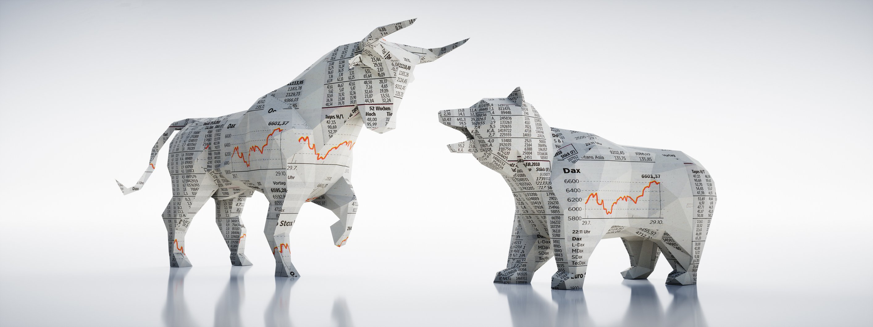 Paper figurines of a bull and a bear facing each other.