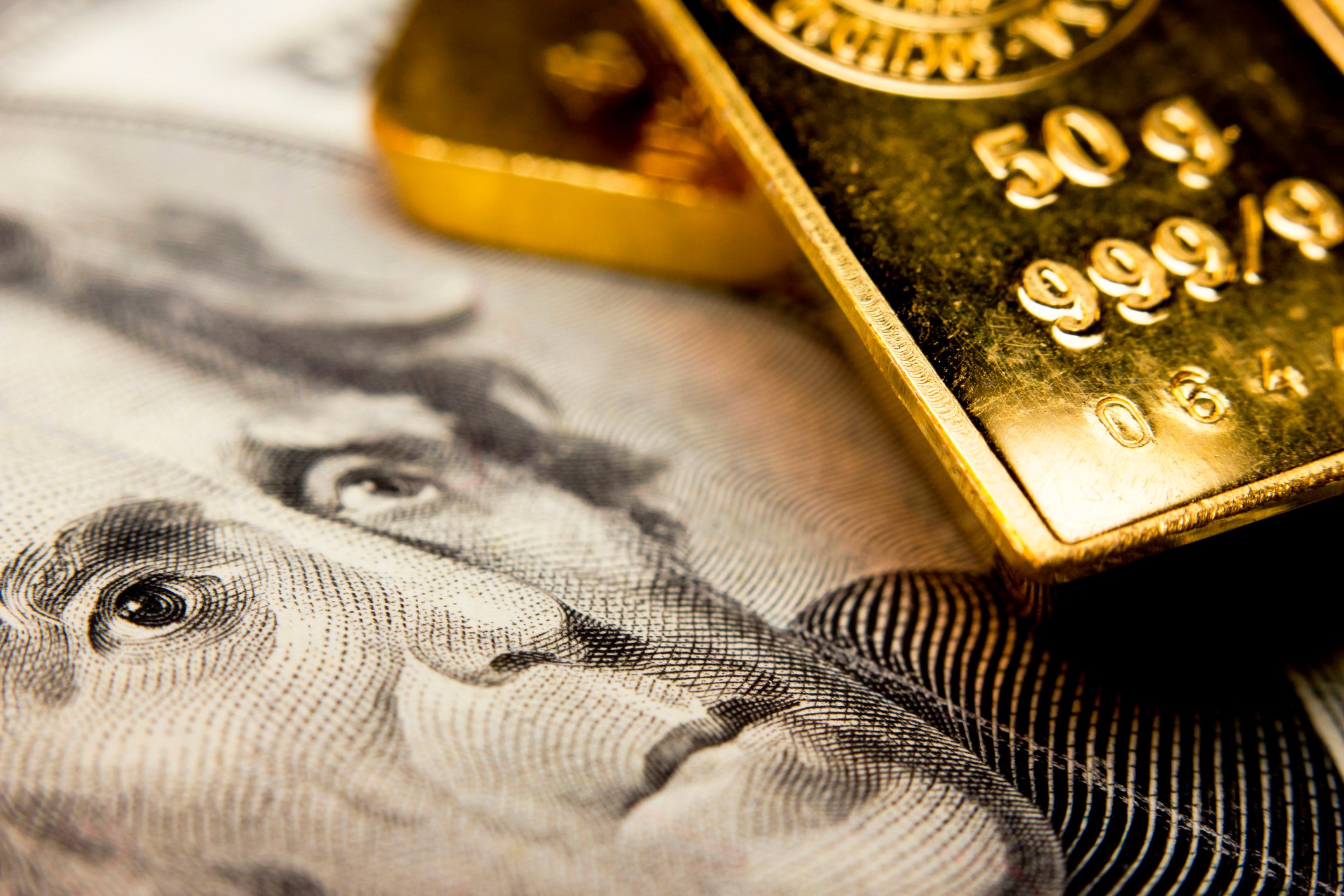 Gold bars on a twenty-dollar bill.