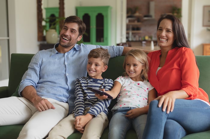 A family watches TV together.