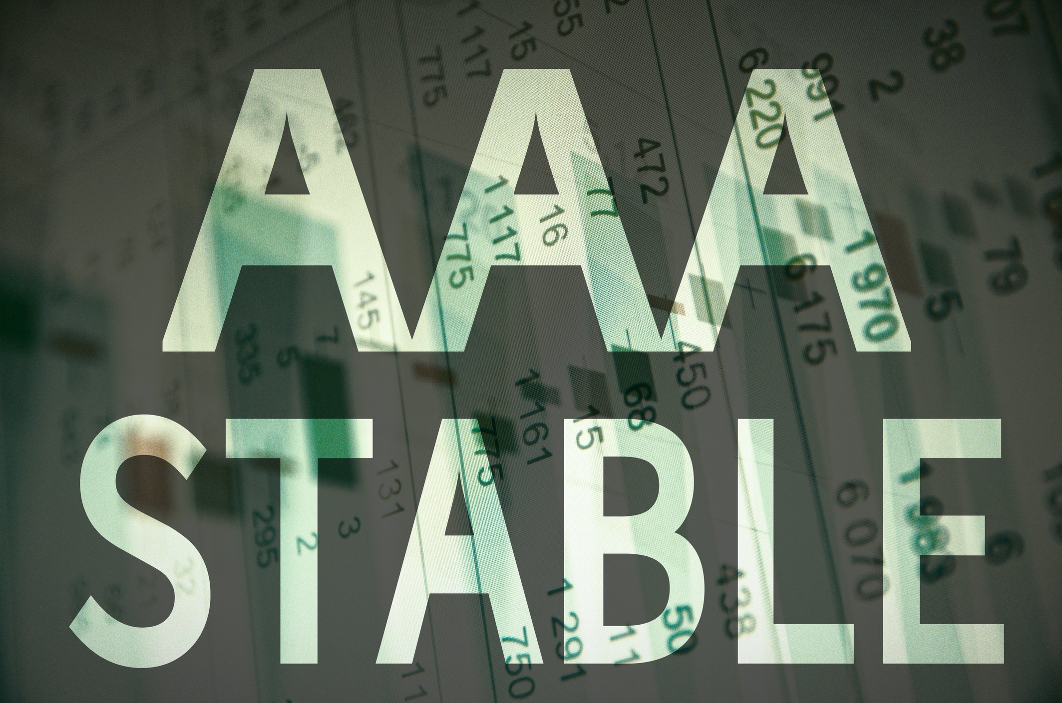 The words AAA Stable superimposed over a financial document