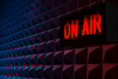 a recording studio wall with an on air sign