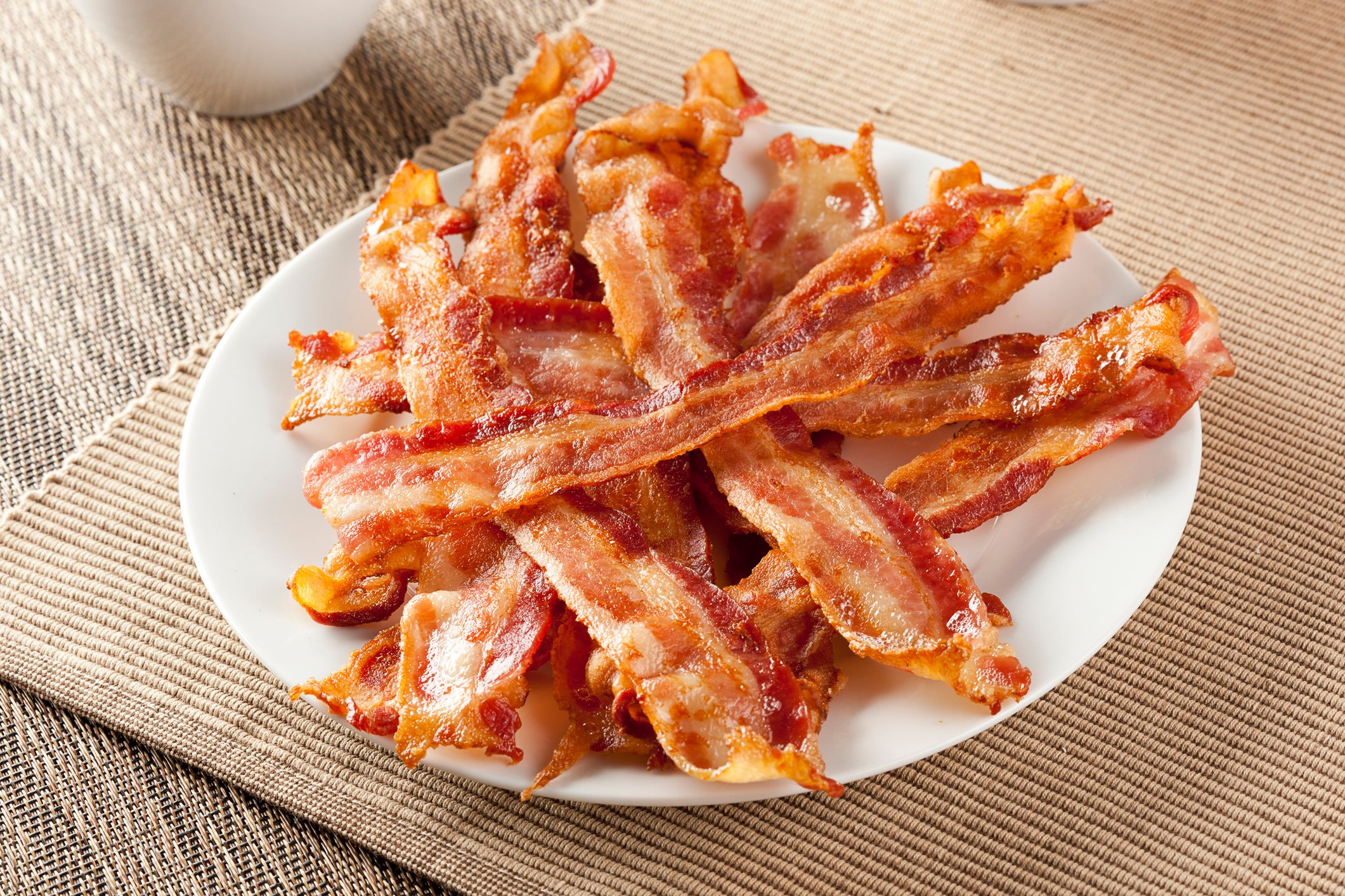 A plate of cooked bacon