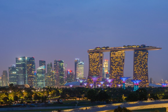 The Marina Bay Casino Resort lit up at night. 