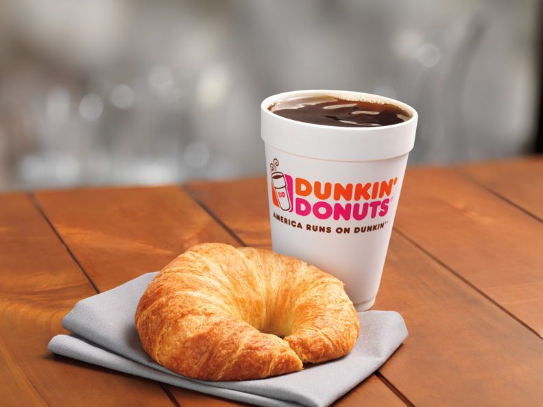 Cup of Dunkin' Donuts coffee and croissant