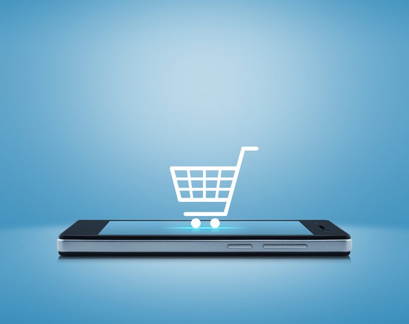 A shopping cart icon on a smart phone.