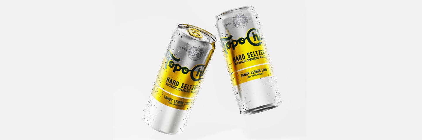 Two coca-cola's Topo Chico hard seltzer cans in promo