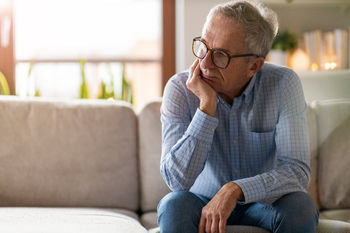 Older man sitting on couch