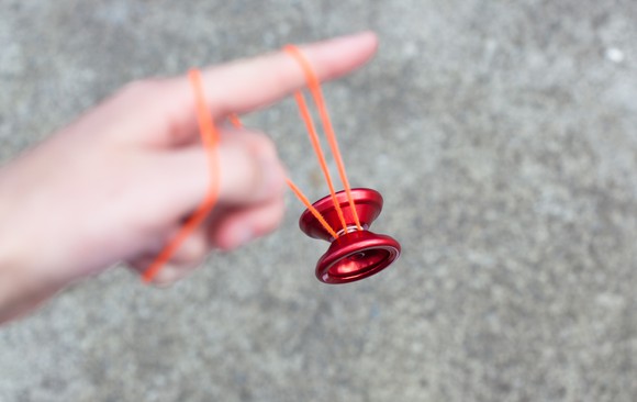 Yo-yo balanced on a finger