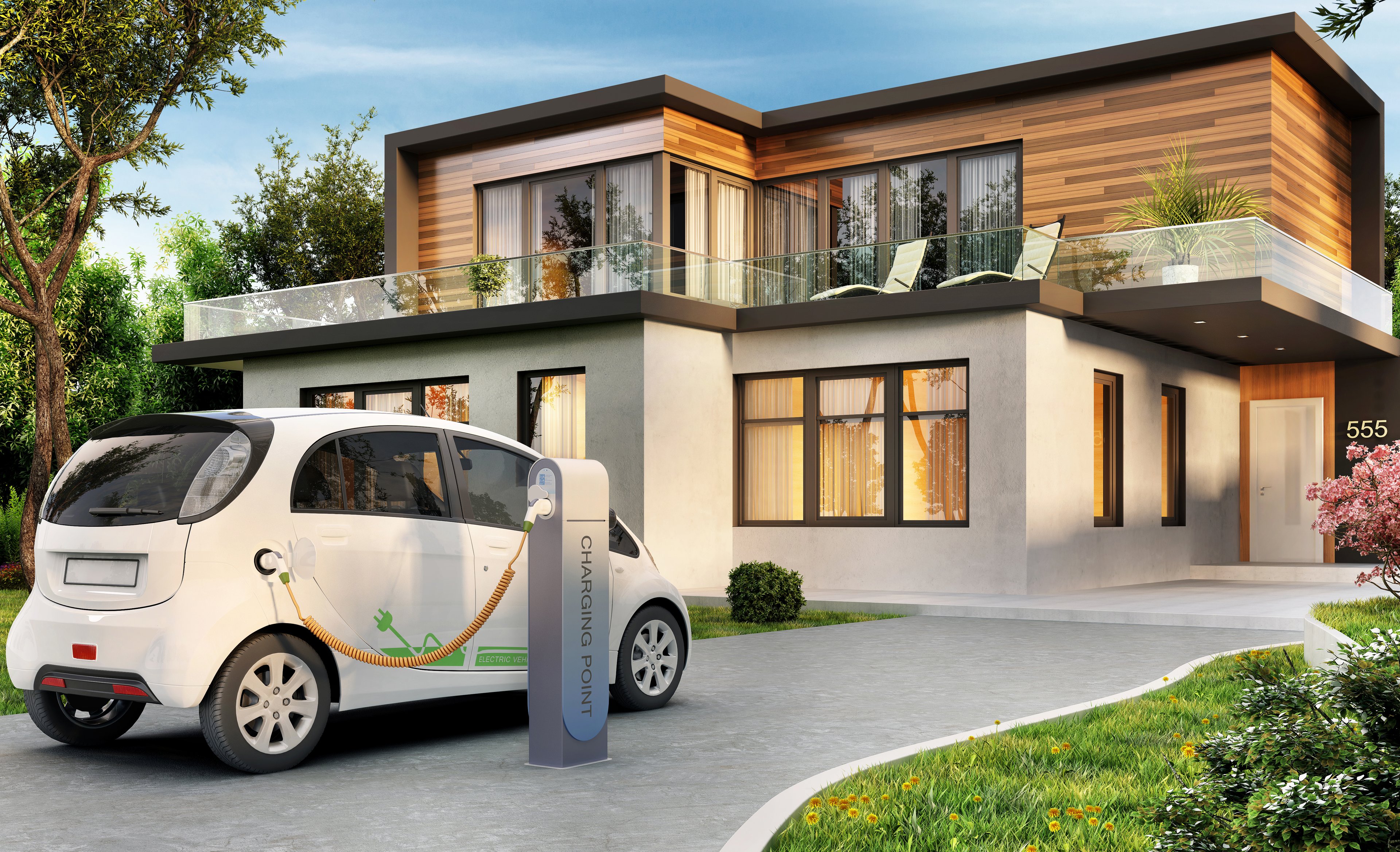 Electric vehicle at a charging station in the driveway of a modern house. 