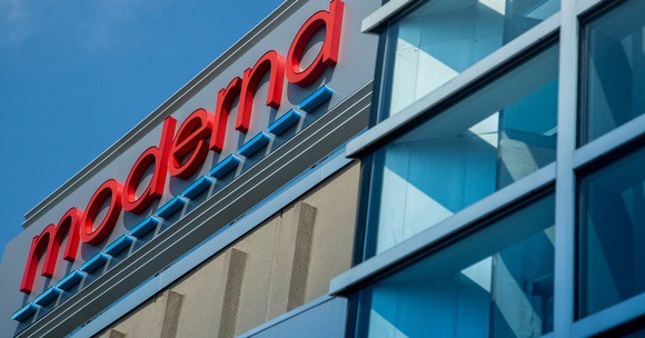Office building with Moderna logo in red on the top floor.
