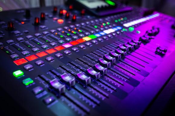 a close up image of a music mixer
