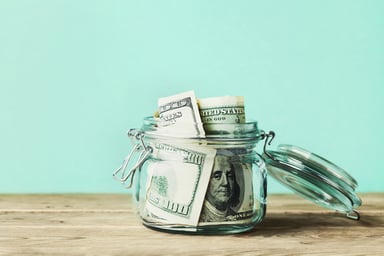 A jar filled with cash.