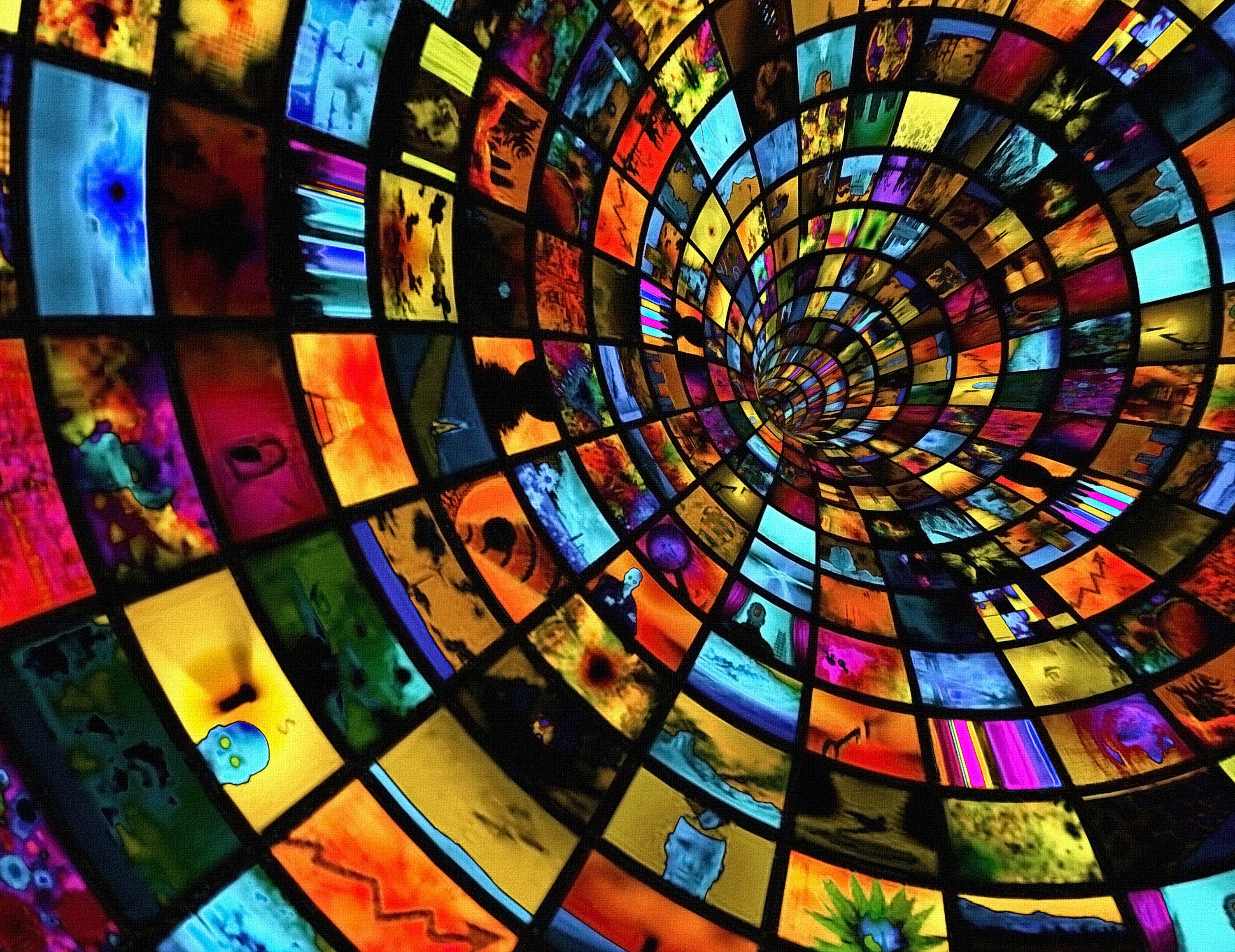 A tunnel lined with broadband video screens on the inside walls. 