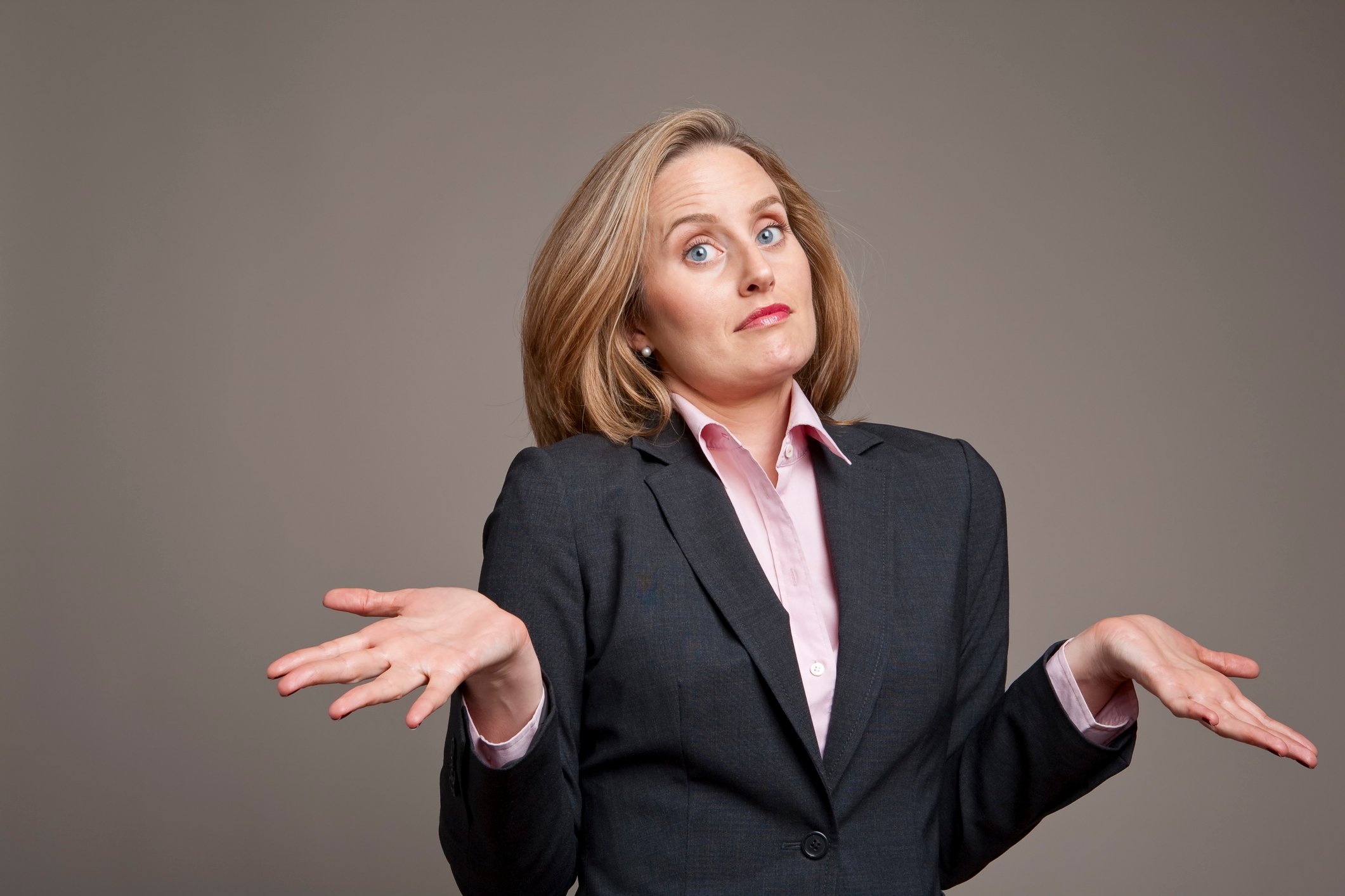 A businesswoman shrugs.