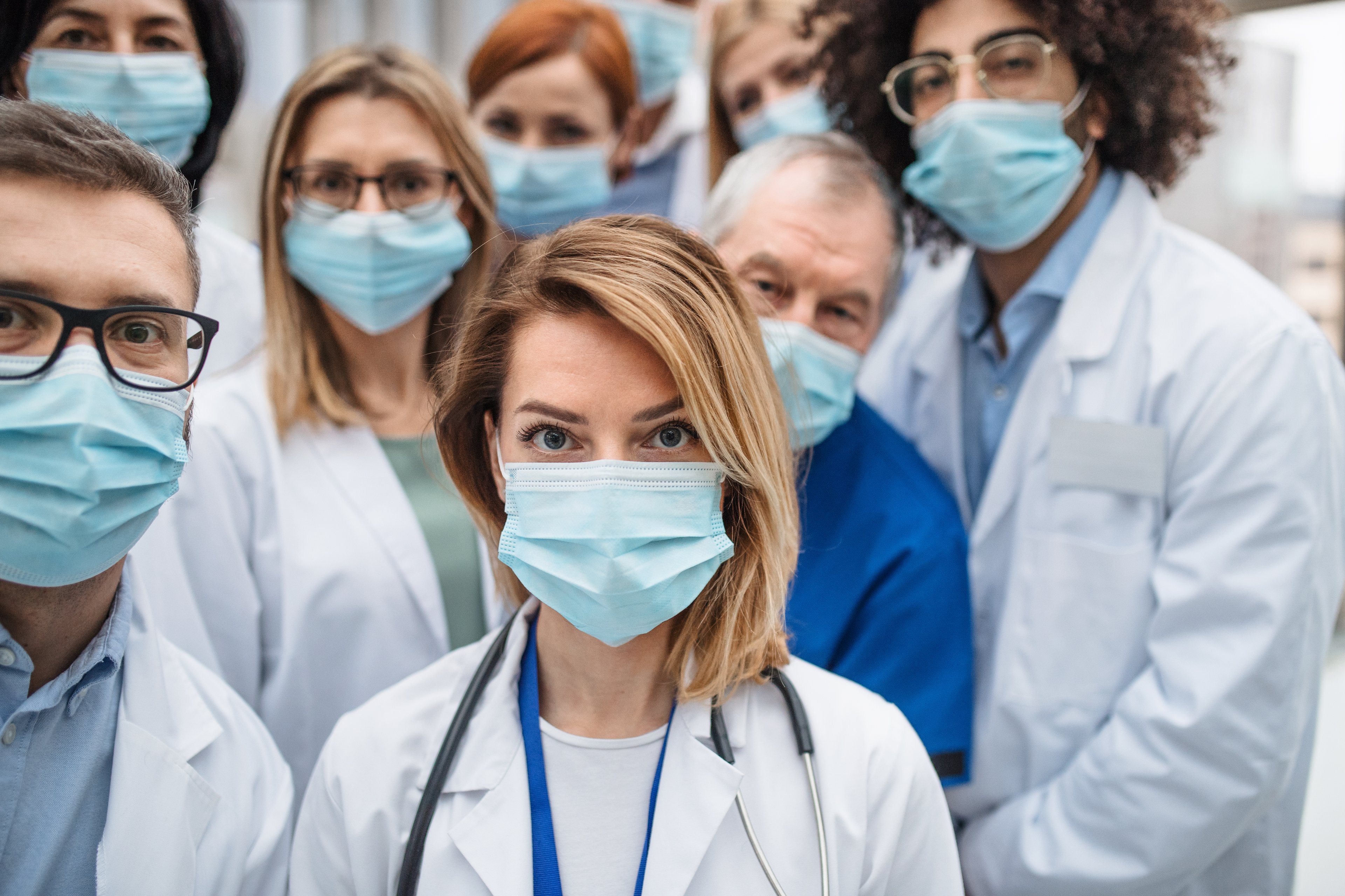 Group of doctors with face masks looking at camera