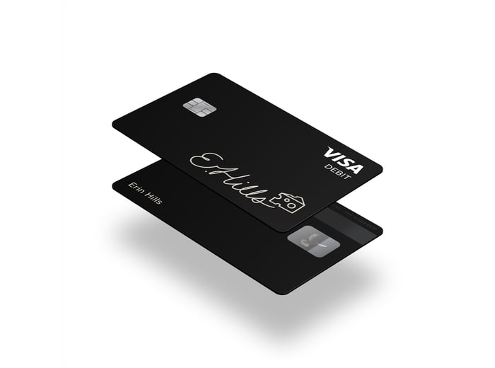 A rendering of a black debit card floating.