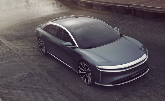 A gray Lucid Air, a sleek full-size electric luxury sedan.