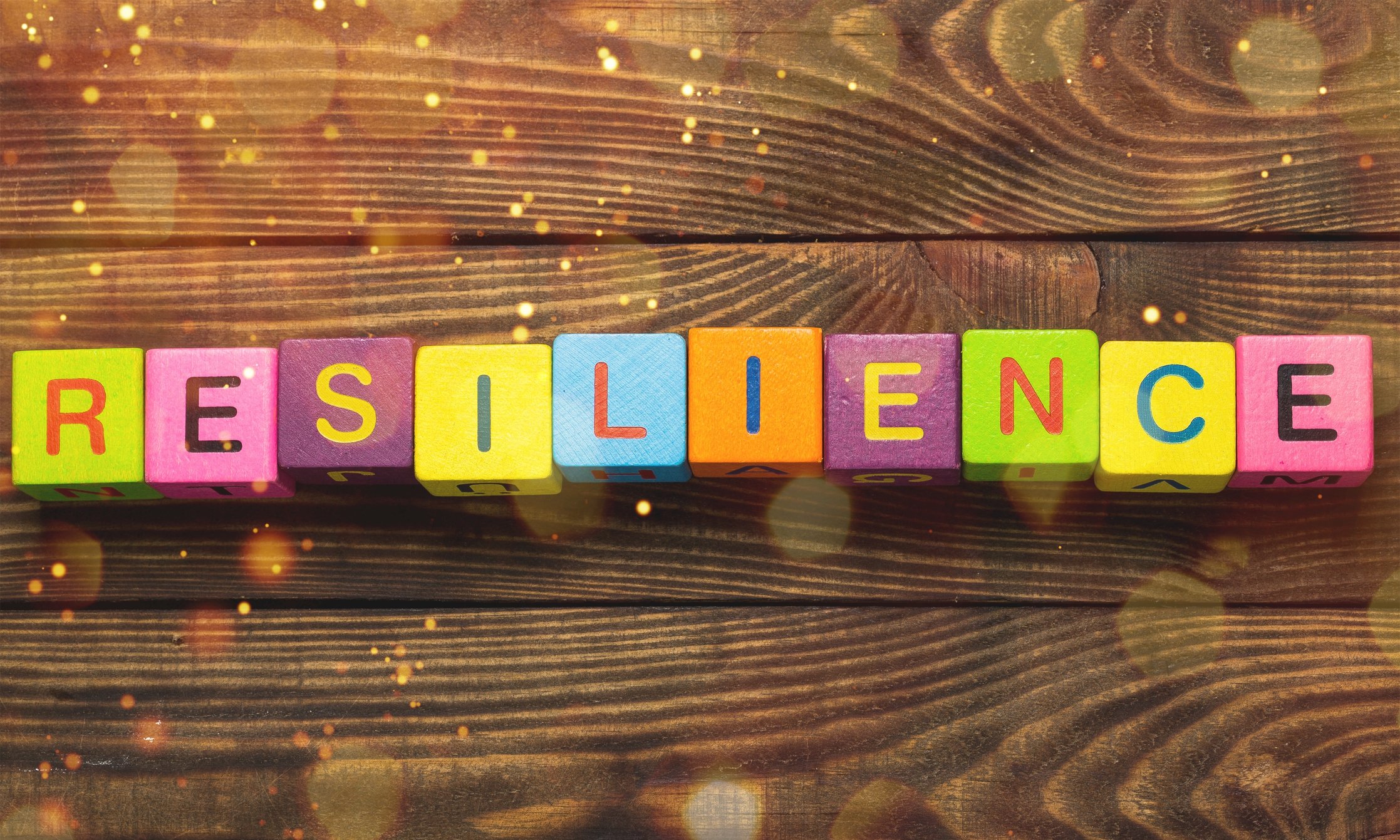 Colored blocks that spell out the word resilience.