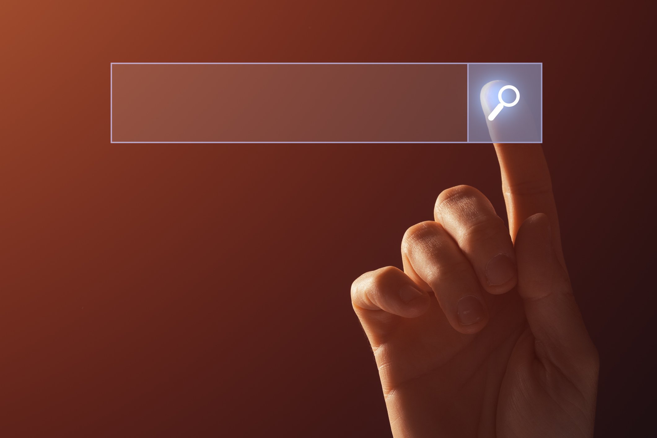 A person touching a search bar.