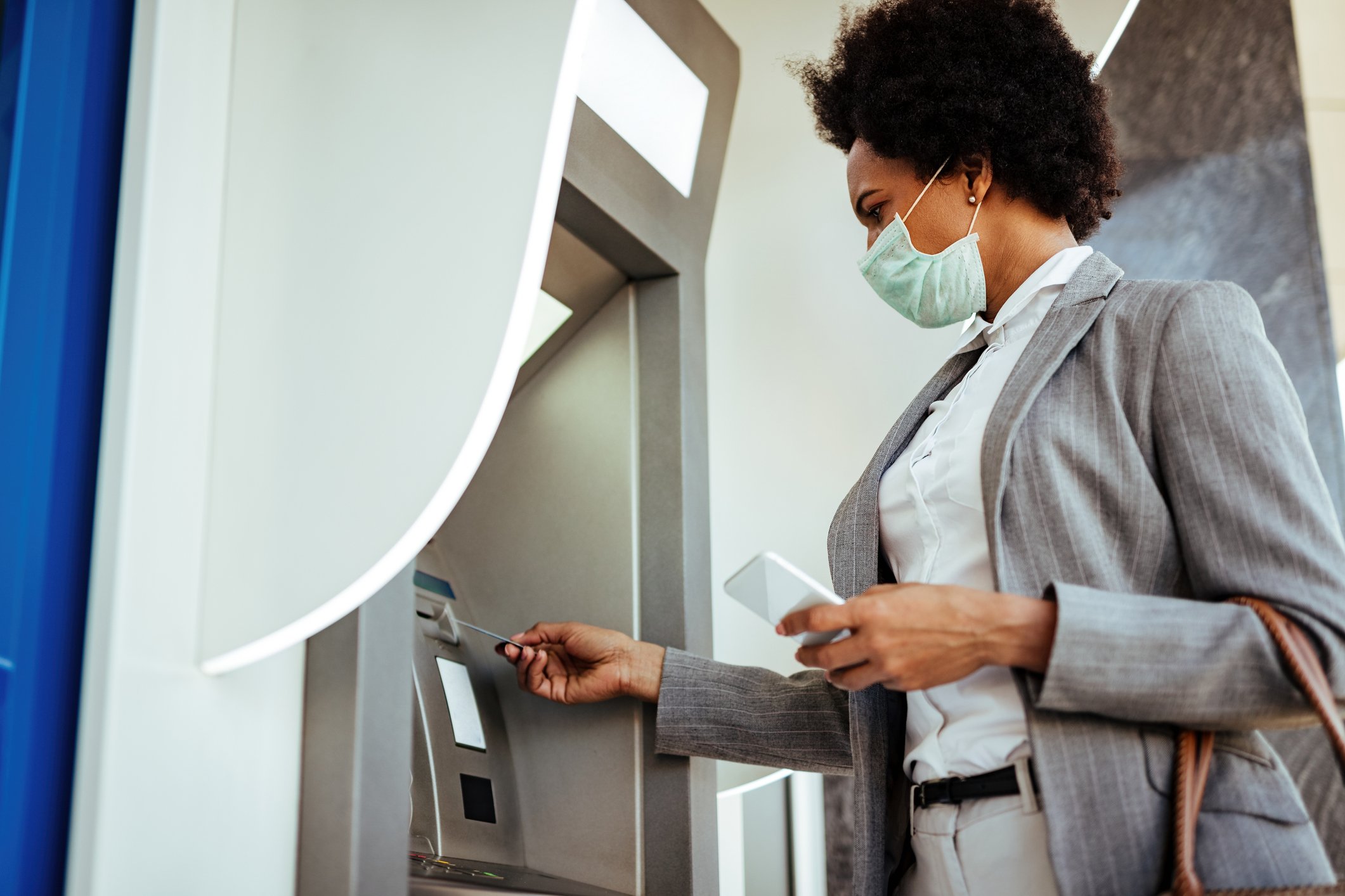 Getty ATM Bank Woman in Mask