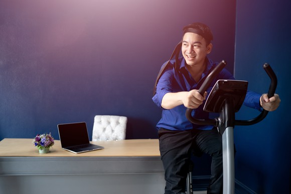 Man using exercise bike.