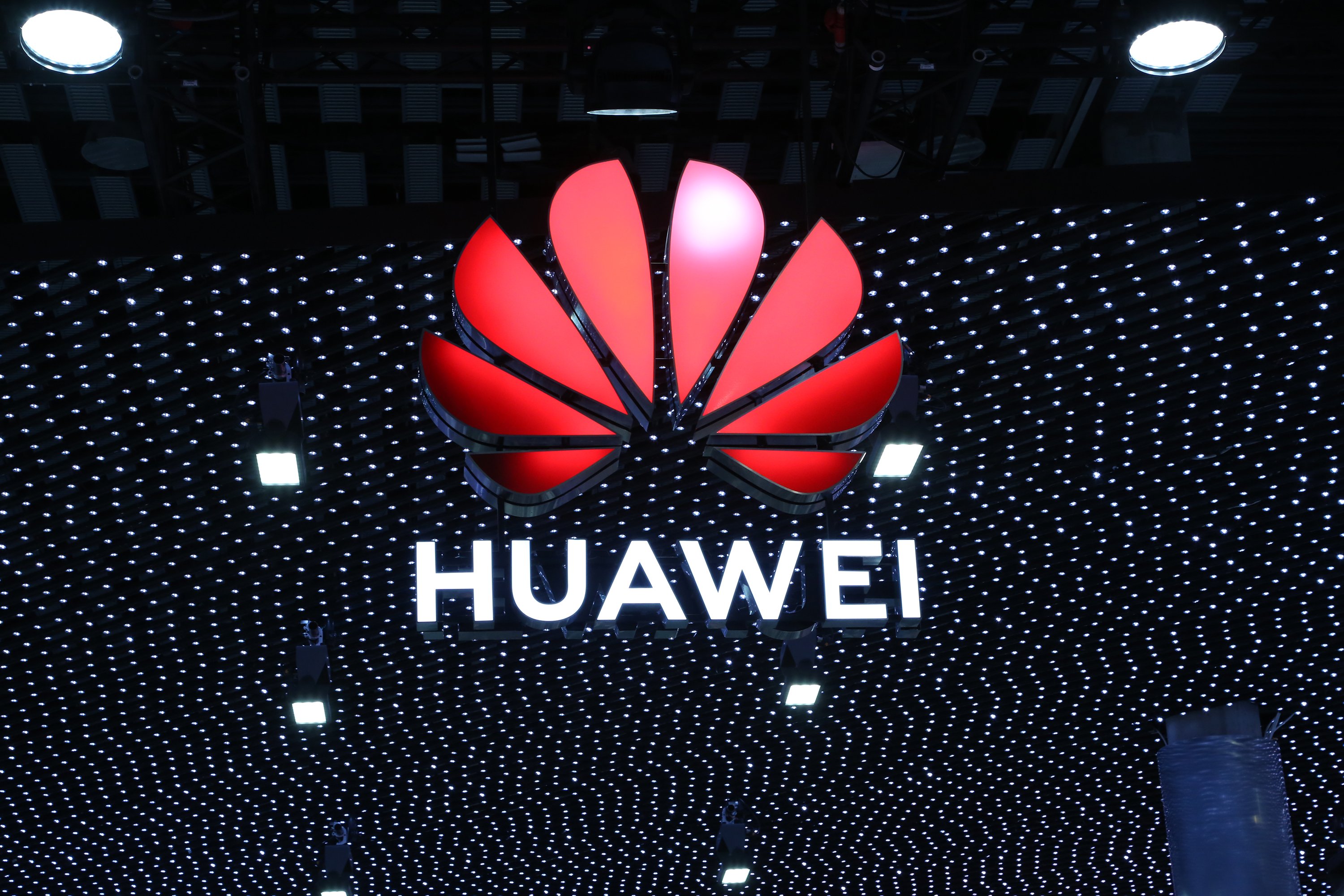 An illuminated Huawei sign at Mobile World Congress 2019