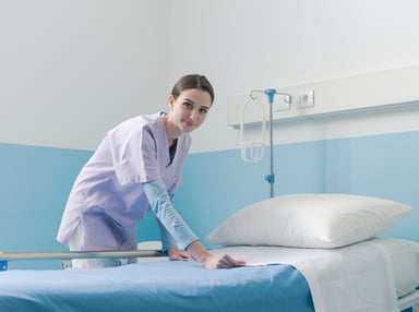 nurse making a bed