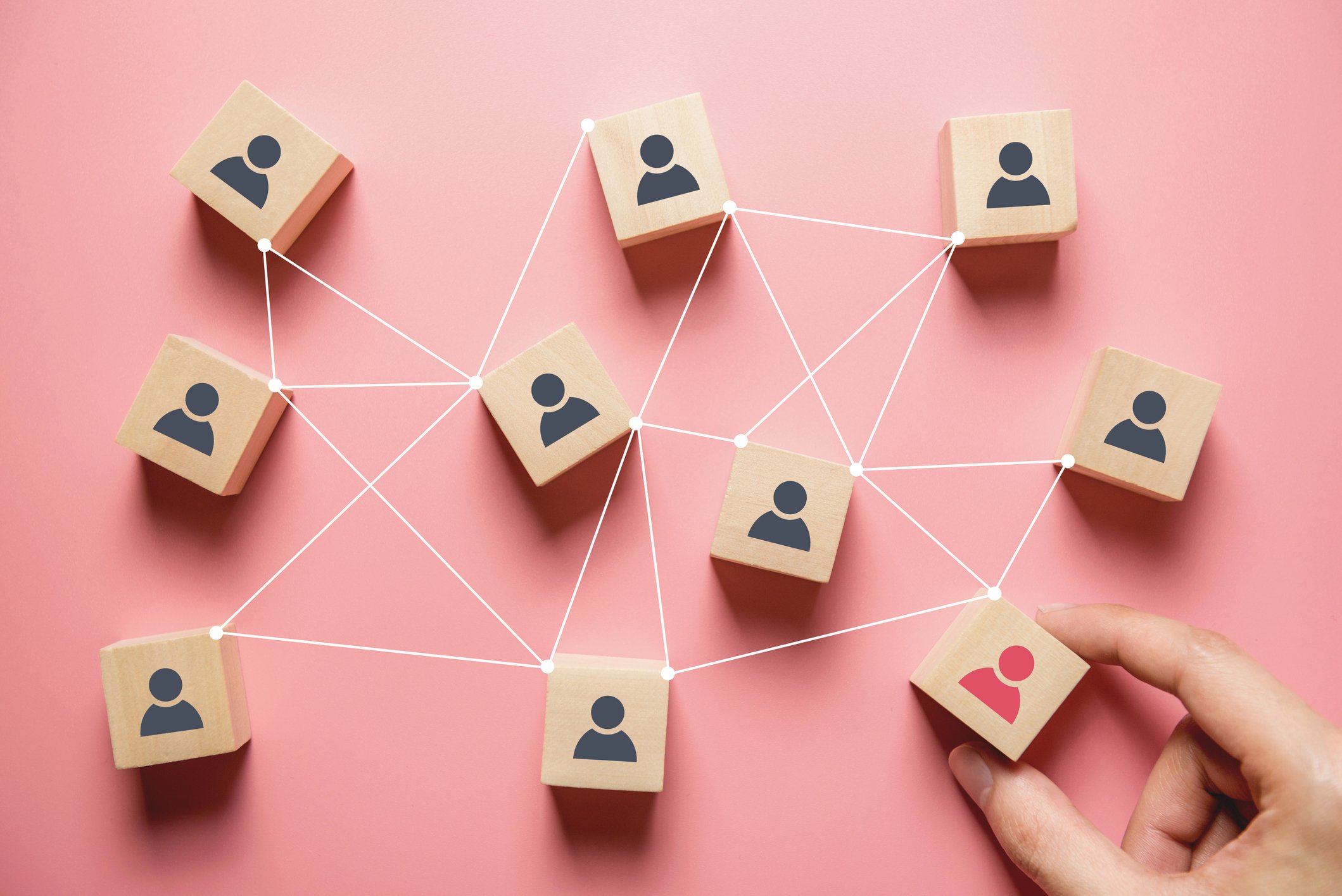 Wood blocks featuring people icons on them.