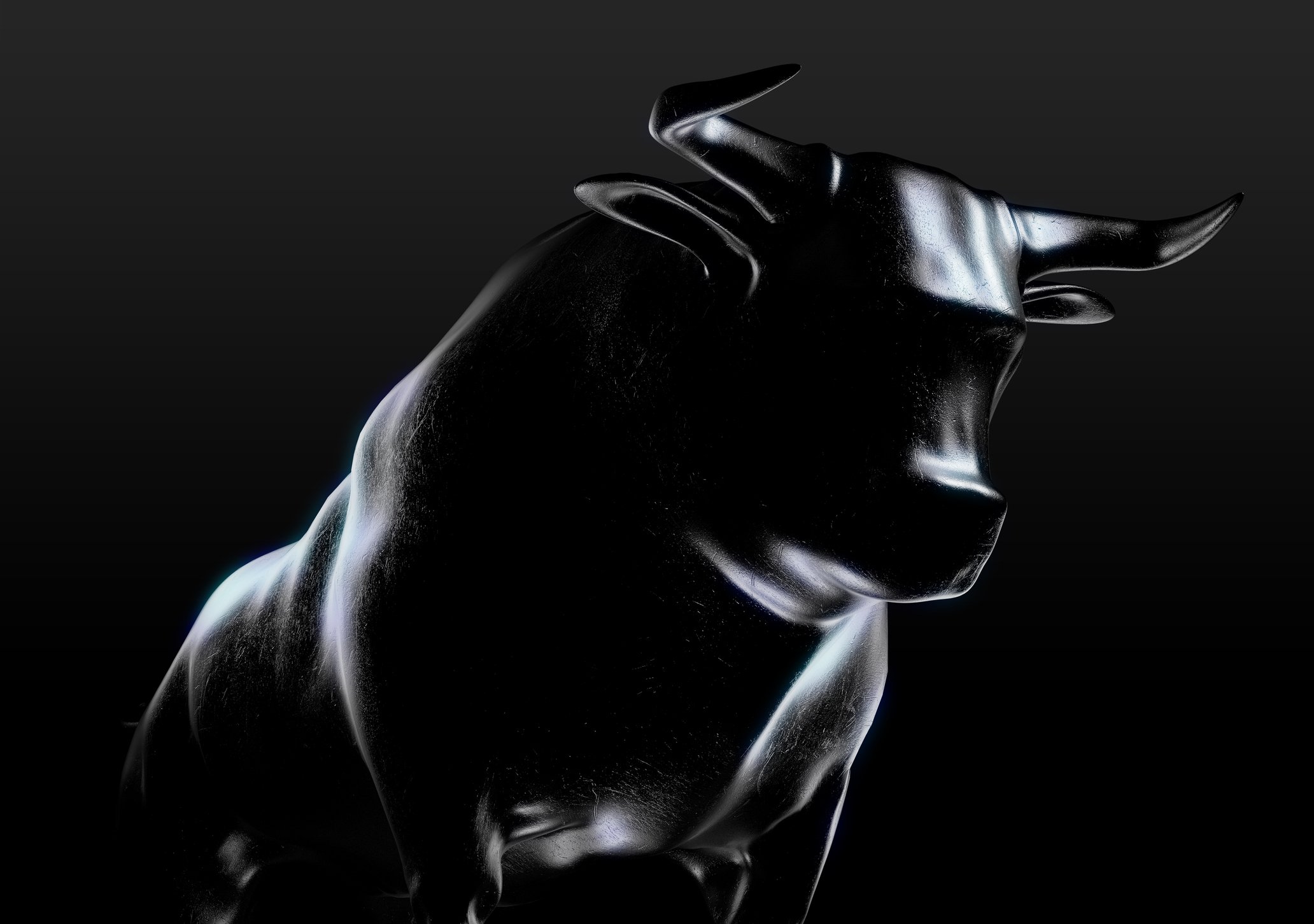 A sculpted metallic casting of a bull with a dark background. 