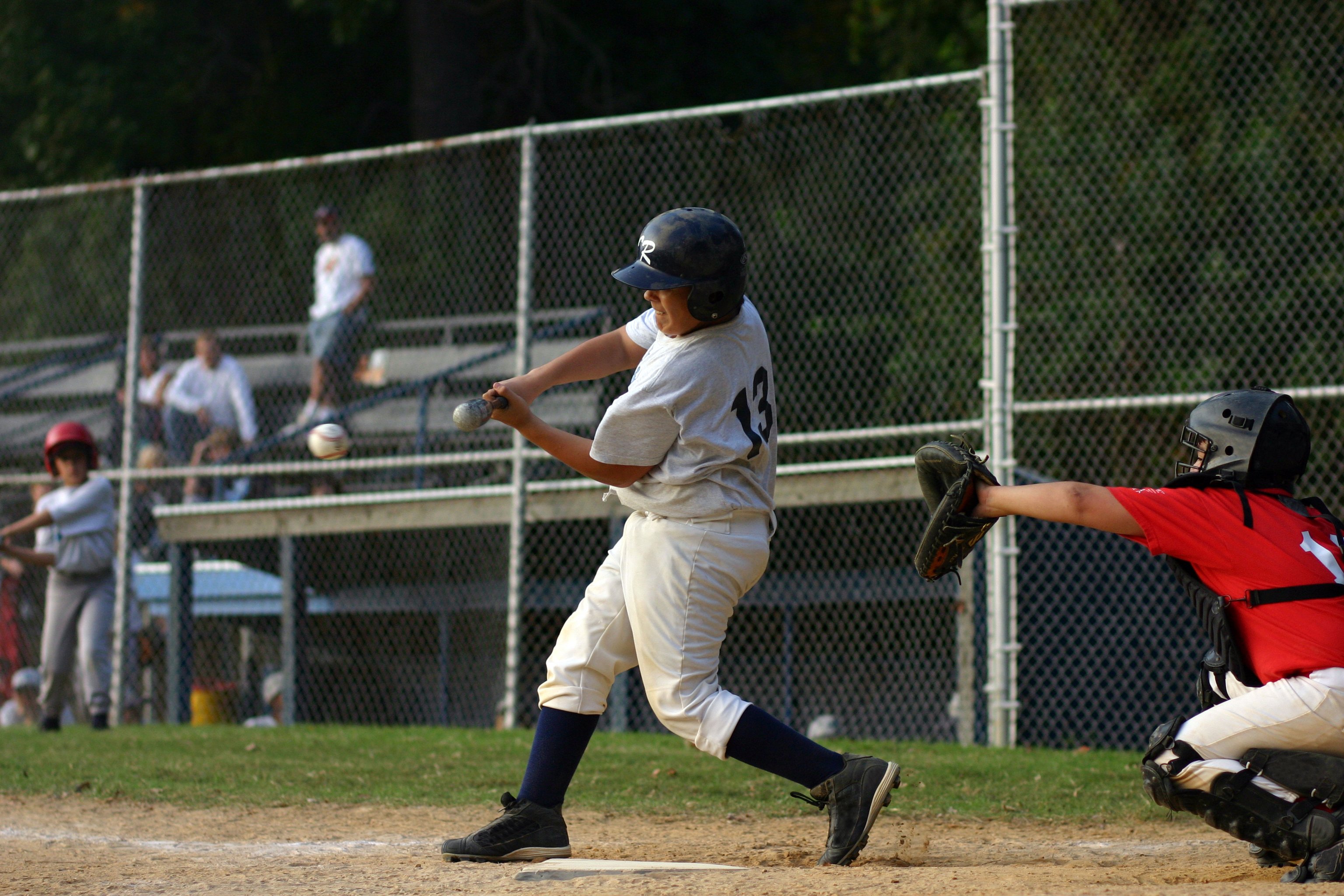 Batter swinging at a baseball