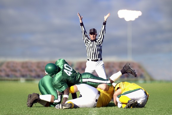 Football referee signaling a touchdown