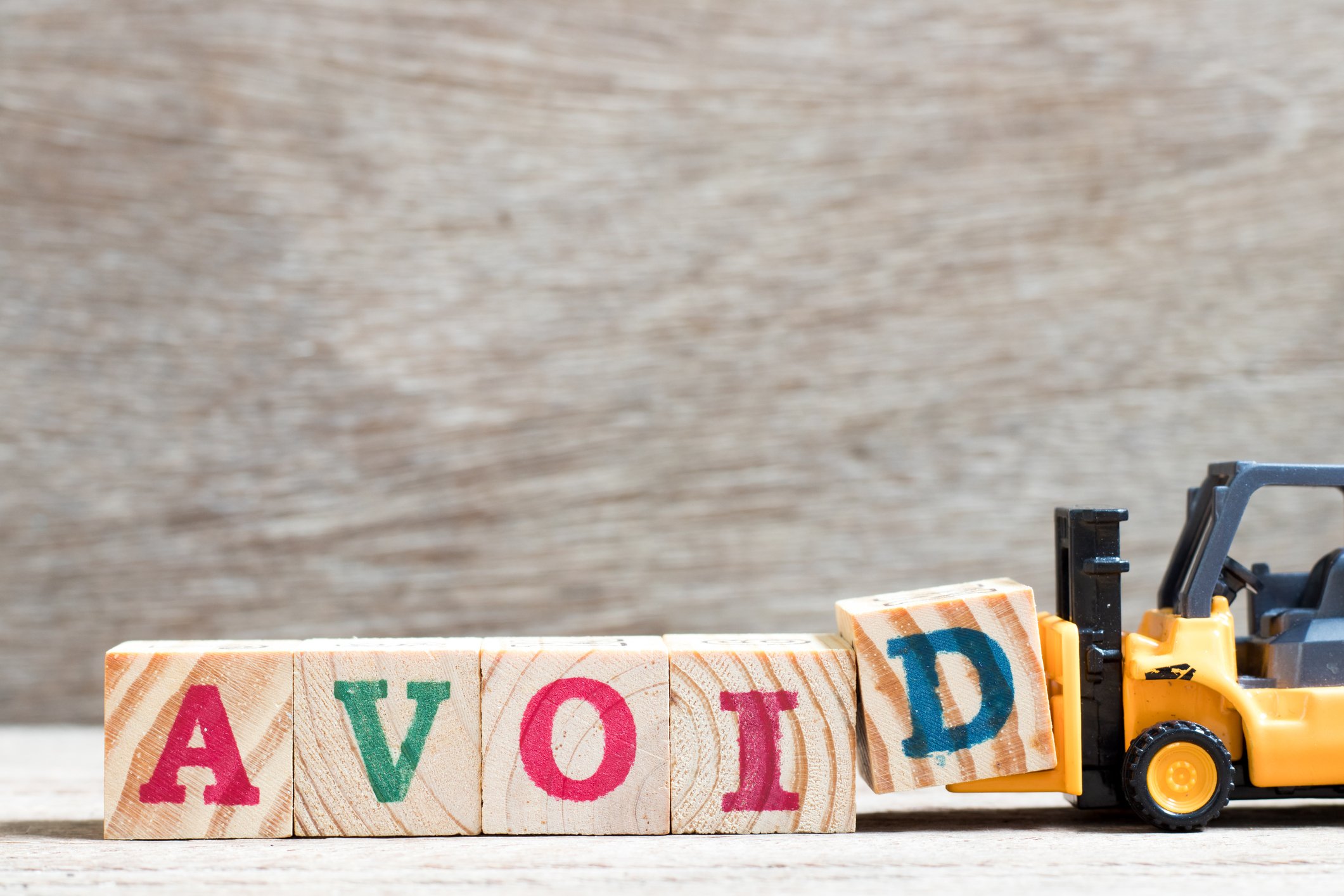 Letter blocks spelling "avoid."