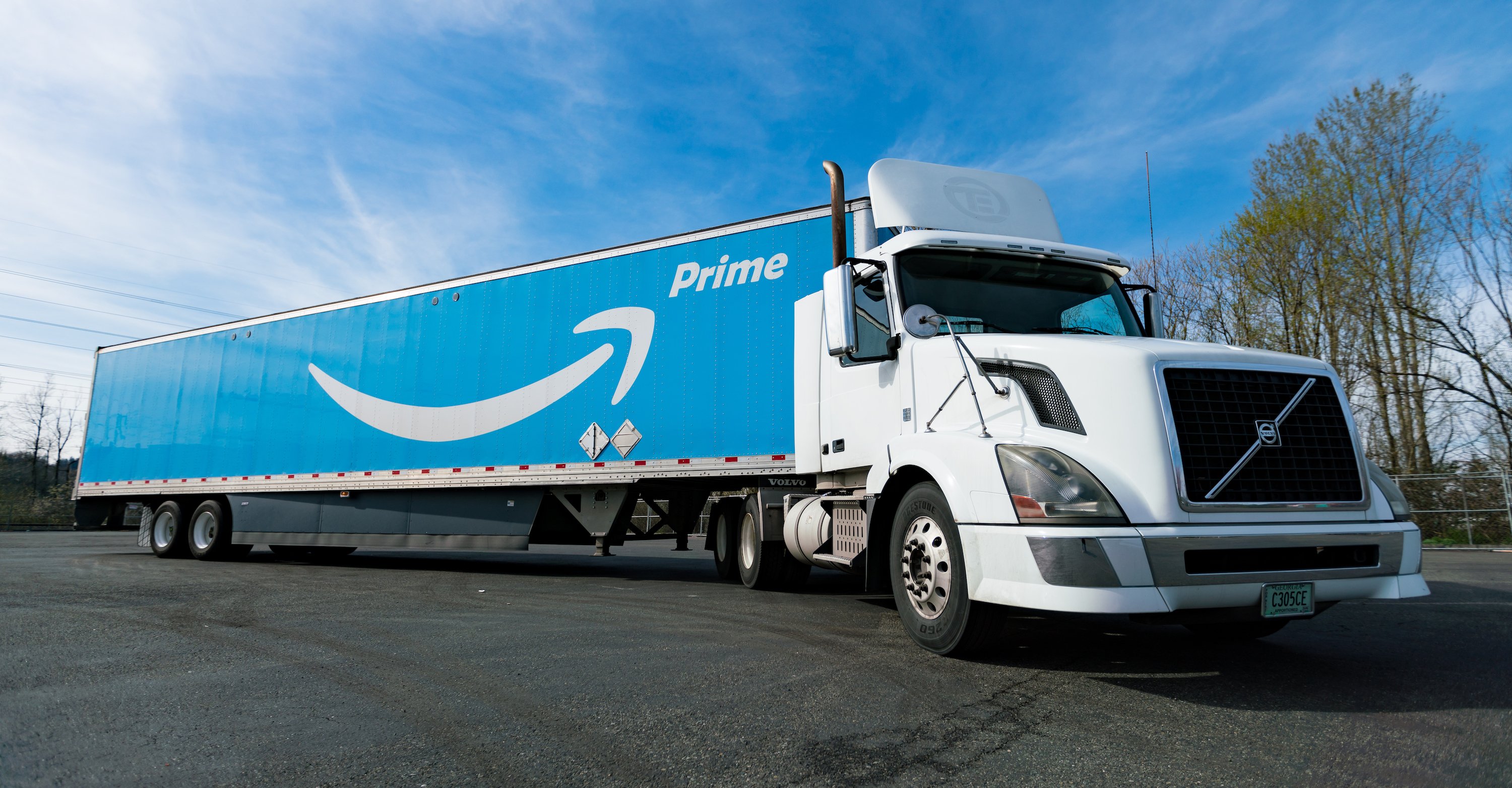 Semitrailer truck with Amazon Prime logo on the side of it