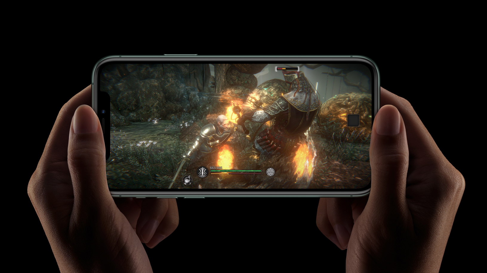 A pair of hand holds an iPhone displaying some gameplay