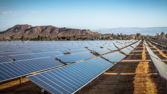 Large solar farm in the desert on a cloudless day. 